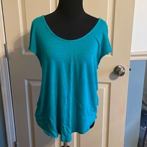 TROUVÉ size large shirt.  Very pretty color!